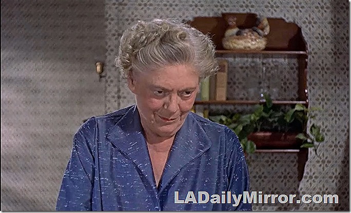 Older woman in blue dress