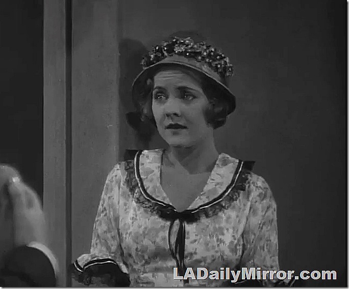 Woman in dress with collar. And hat. 