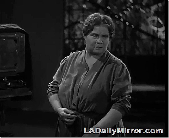 Heavy-set woman with a disapproving look. 