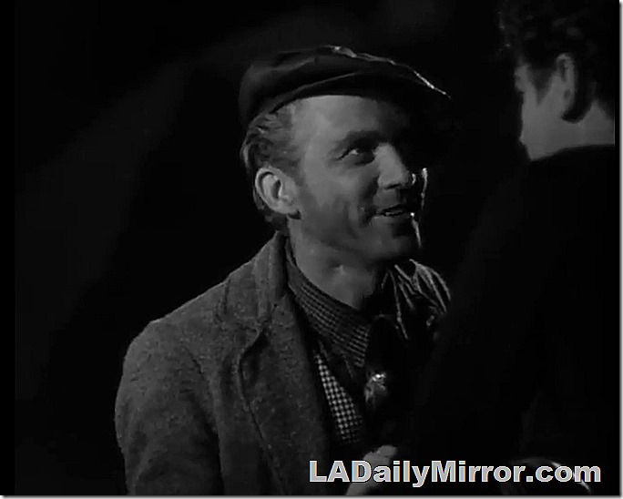 Man in newsboy cap, checked vest and checked shirt. Check it out!