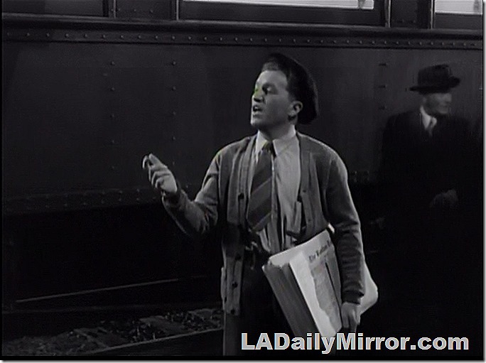 Mysterious newsboy in mysterious newsboy cap doing newsboy stuff. 