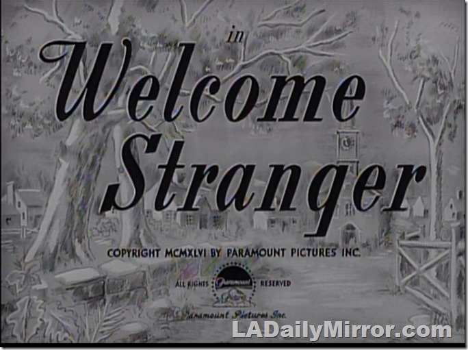 Main title: Lettering over sketch of small town. 