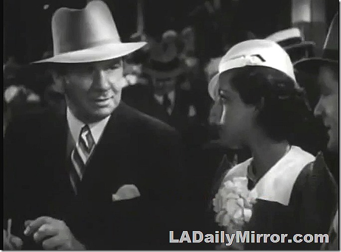 Sharp-dressed mystery man and mysterious woman companion. 