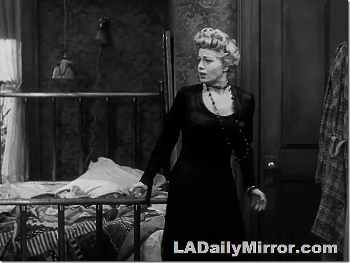 Mystery woman with long necklace. She is rather upset. 