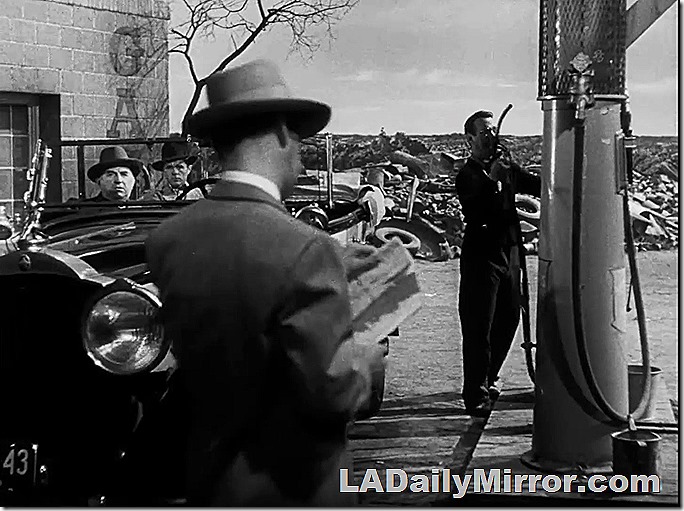 1920 gas station with mystery car