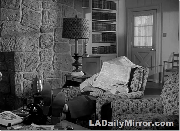 Mystery guest asleep under a newspaper. Mystery guest asleep under a newspaper.