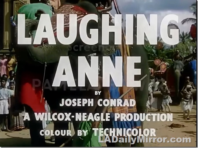 Main title: Lettering over parade of elephants and native dancers. 