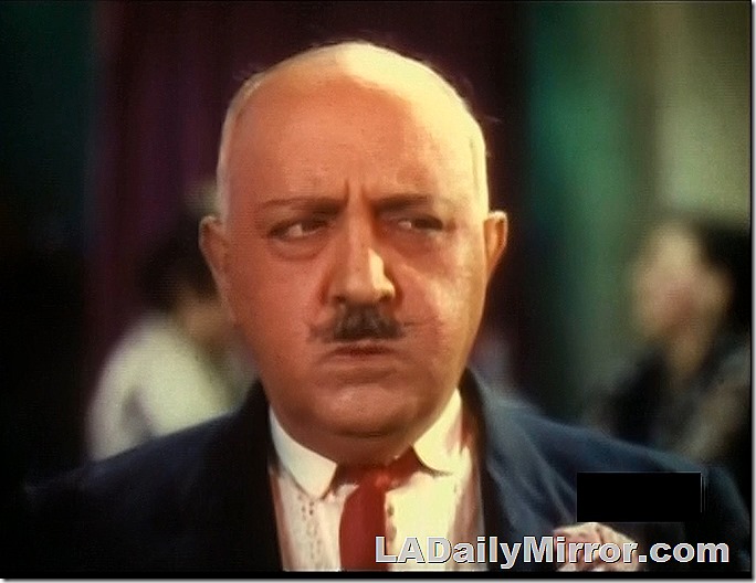 Mystery man, bald, with mustache. 