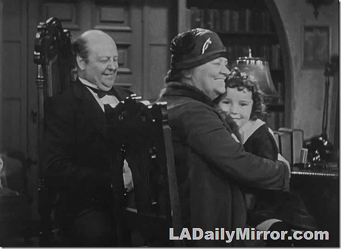 Couple with woman embracing girl