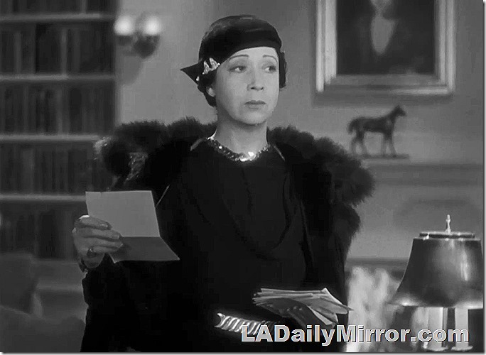 Woman in fur coat, elegantly dressed.