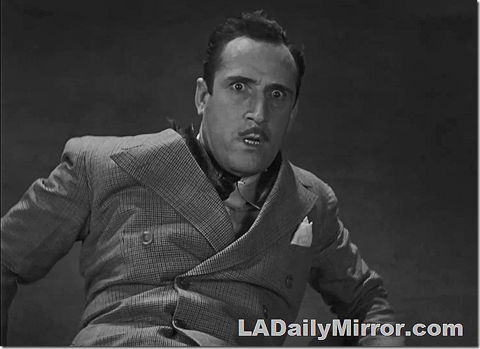 Man in double breasted suit. He looks astonished.