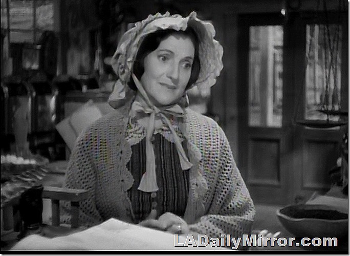 Pioneer woman in shawl and bonnet