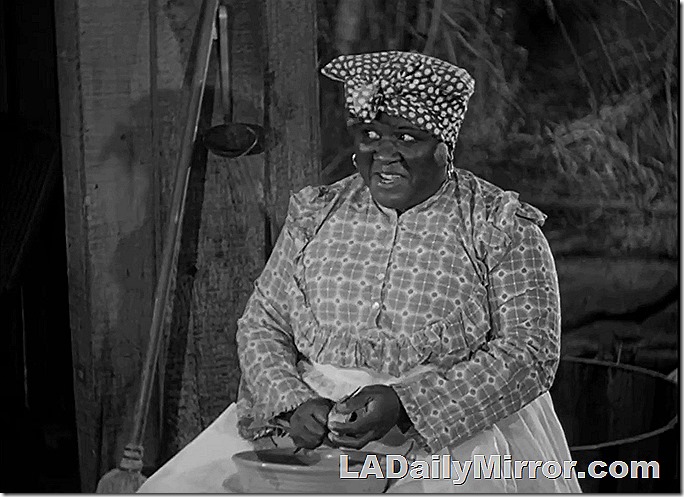 Woman peeling potatoes.