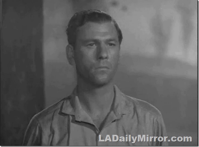 Mysterious man, bareheaded, in an open-collared shirt. 