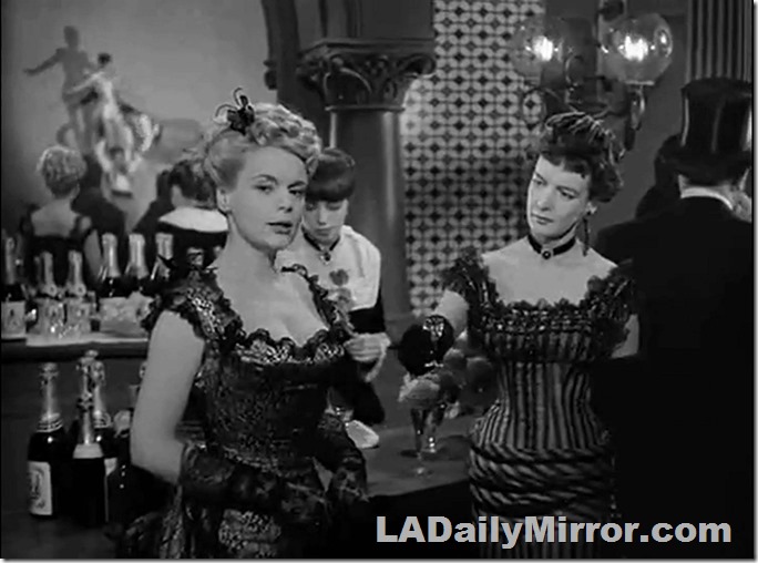 Woman in revealing outfit does not approve of such goings-on. 