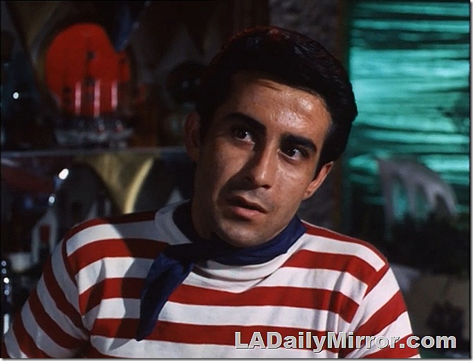 Man in shirt with red and white stripes. 