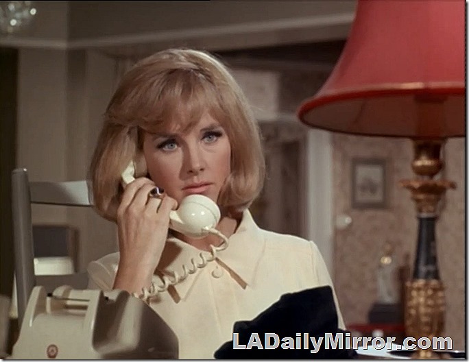 Blonde woman on telephone.