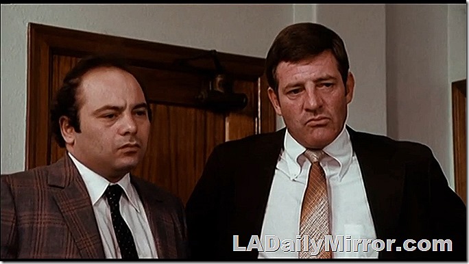 Men in suits. Not smiling. 