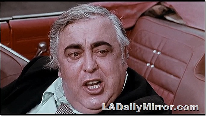 Beefy man in convertible.