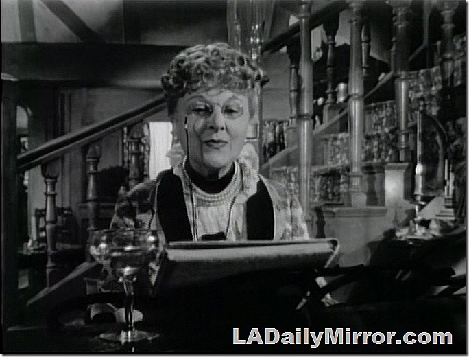 Woman sitting at piano. She's wearing pince-nez glasses. Woman sitting at piano. She's wearing pince-nez glasses.