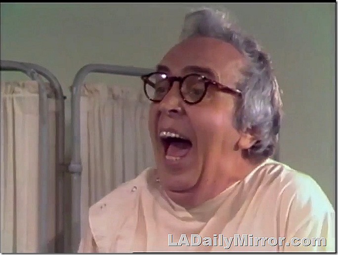 Laughing man in glasses. 