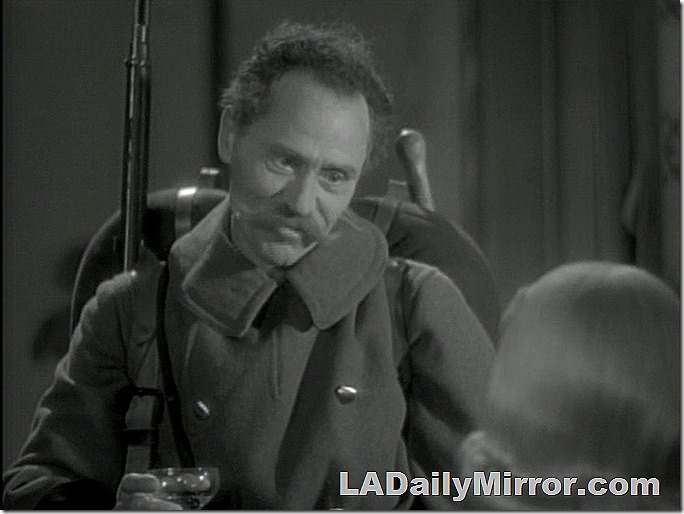 Man in military uniform with rifle