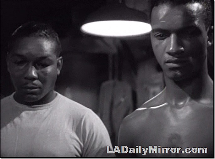 Two mysterious guests. One man is bare-chested. 