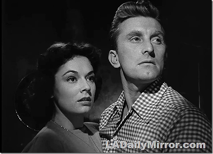 Man in checked shirt with woman in sweater