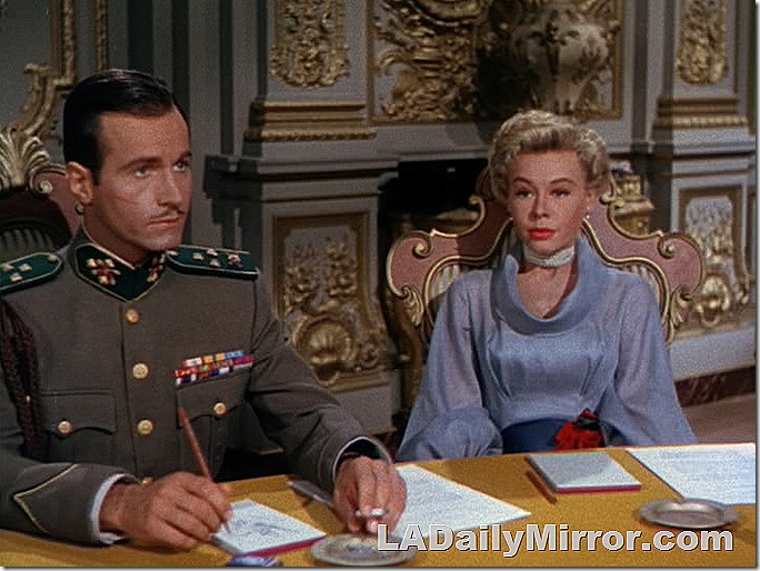 Military officer in uniform with ribbons and attractive woman in formal meeting room. Military officer in uniform with ribbons and attractive woman in formal meeting room.