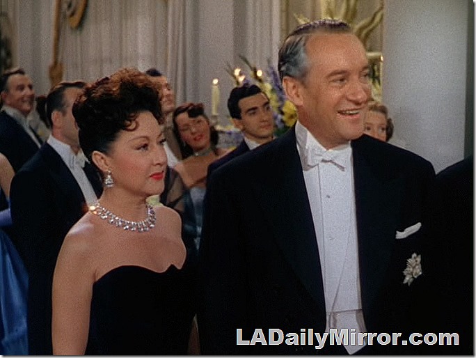 Man and woman in formal attire at a fancy reception. Man and woman in formal attire at a fancy reception.