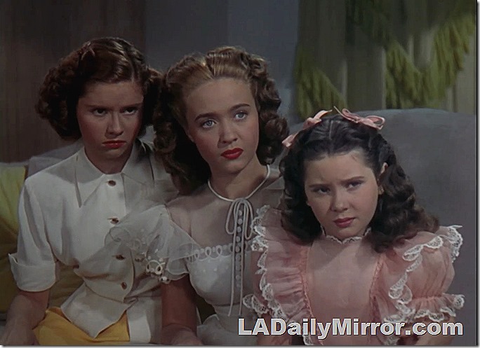 Three young women, rather somber looking
