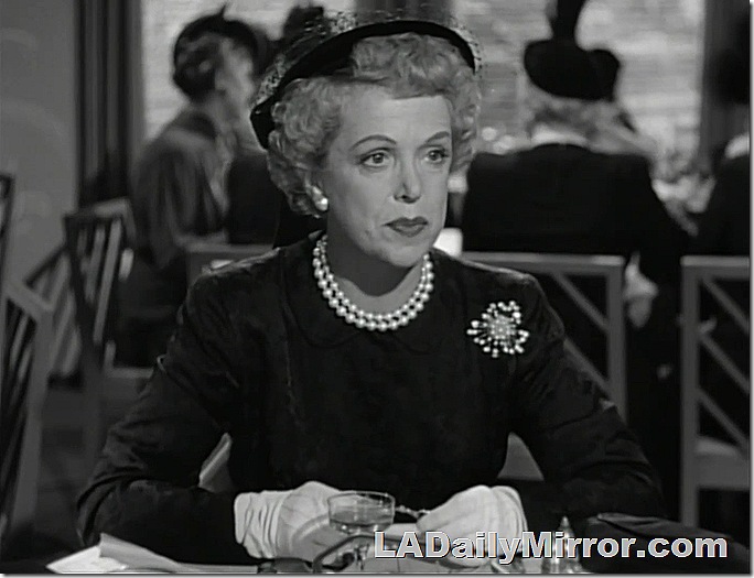 Elegant woman in dress, hat and pearls. She's wearing gloves!