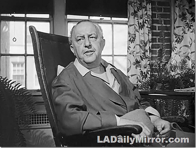 Man in robe sitting in chair. Man in robe sitting in chair.