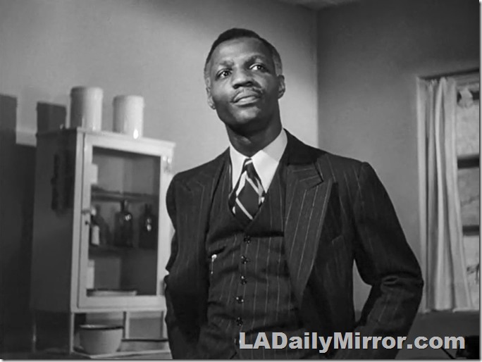 Man in three-piece, pinstriped suit with wide lapels. Man in three-piece, pinstriped suit with wide lapels.