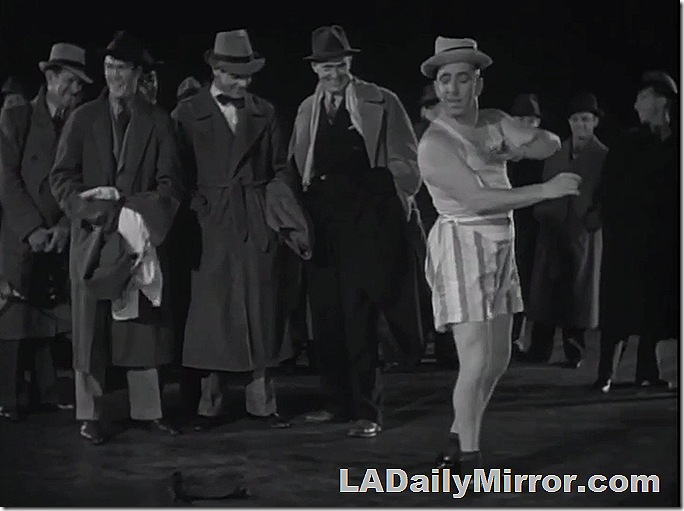 Man in a hat and underwear in front of a crowd. What is the meaning of this?