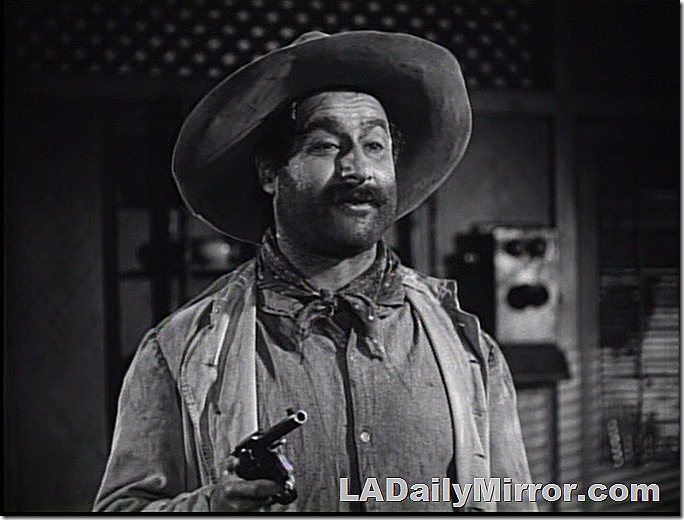 Man in rough clothes and hate, with a gun. Man in rough clothes and hate, with a gun.