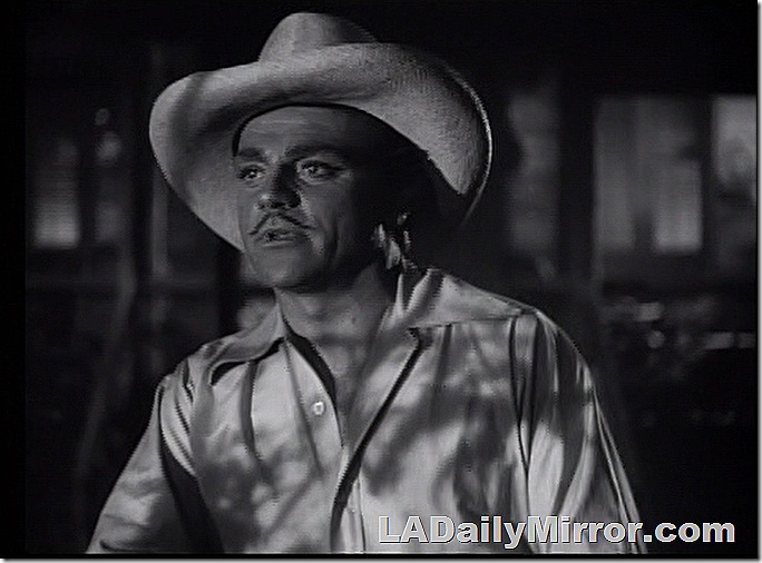 Man with slight mustache, shirt with open collar and broad straw hat. Man with slight mustache, shirt with open collar and broad straw hat.