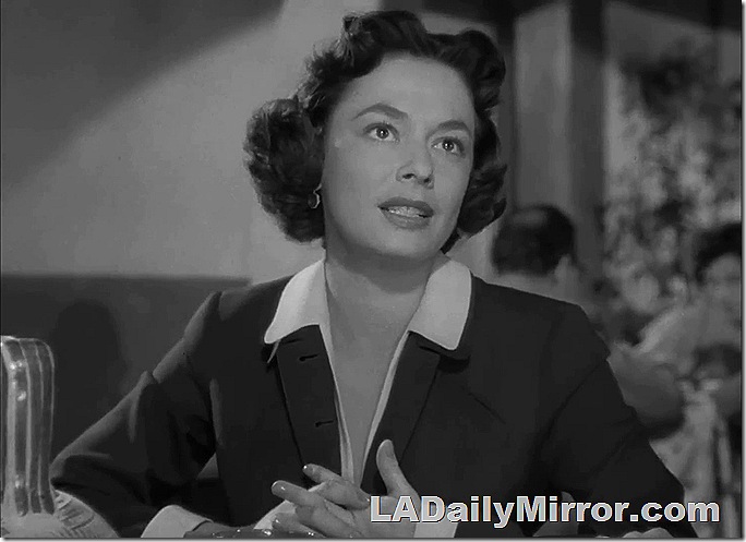 Woman with dark hair, wearing suit. Woman with dark hair, wearing suit.