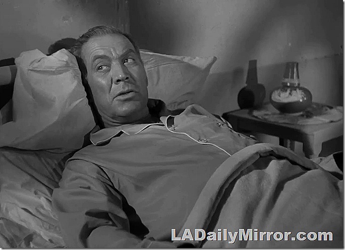 Man in bed wearing pajamas. Man in bed wearing pajamas.