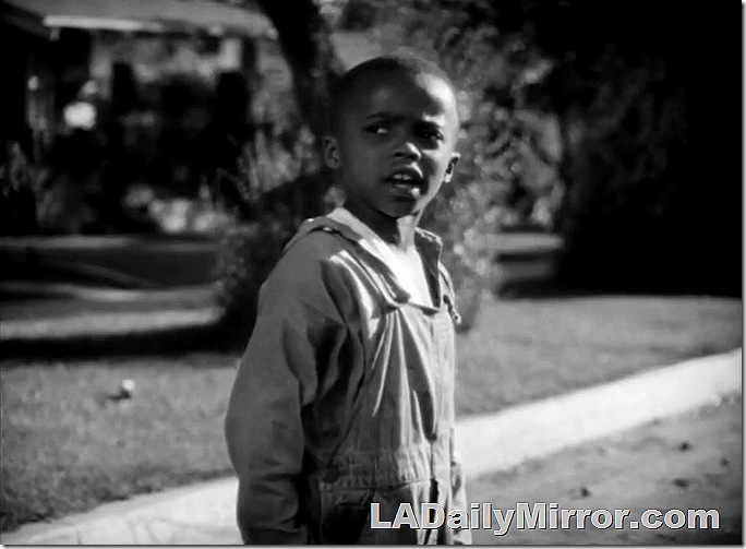 Young boy in overalls