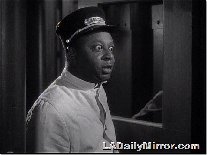 Railroad porter with astonished expression. 