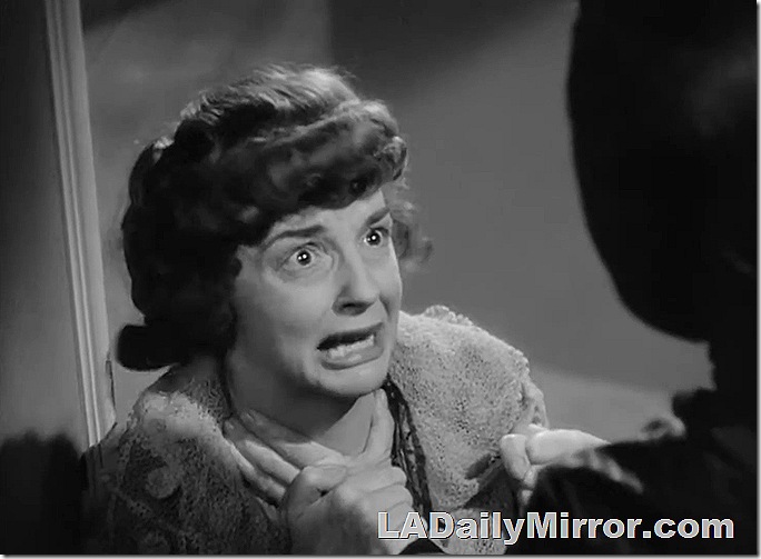 Woman grimacing, having an intense moment. 