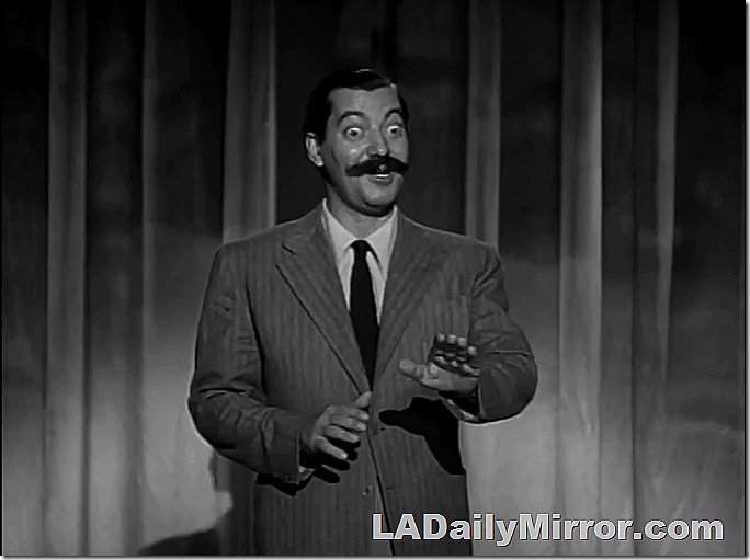 Man in suit, with huge mustache. 