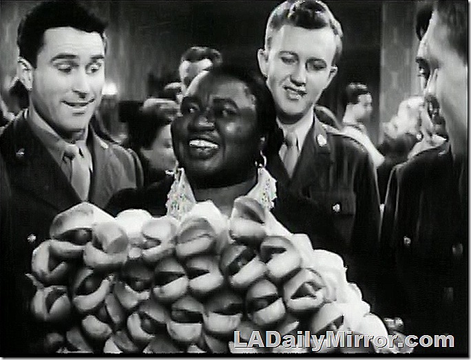 Woman with platter of hot dogs