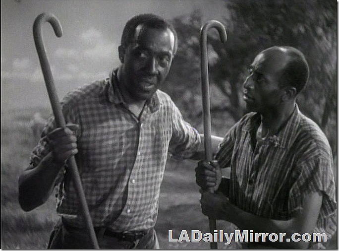 Two men holding shepherd's crooks