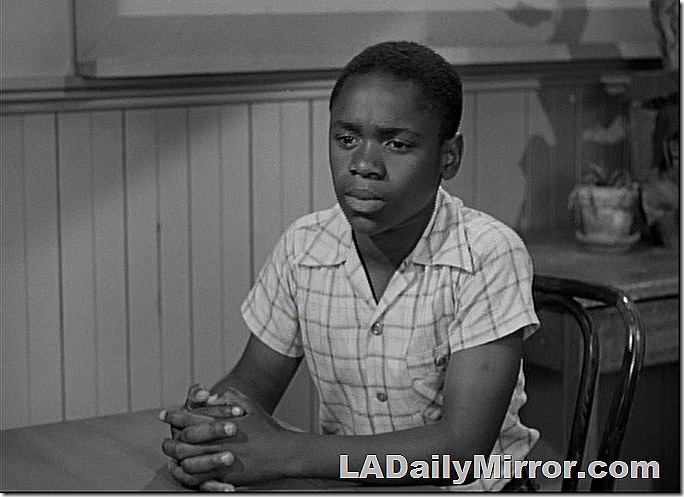 Boy in short-sleeved shirt sitting at desk. Boy in short-sleeved shirt sitting at desk.