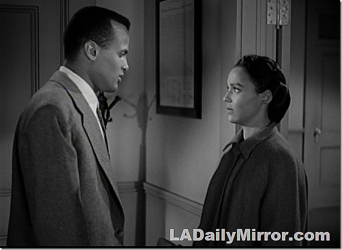 Man in coat and tie facing woman in coat. Man in coat and tie facing woman in coat.