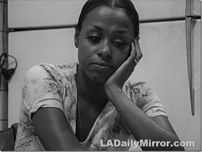 Woman resting her head in her hand. 