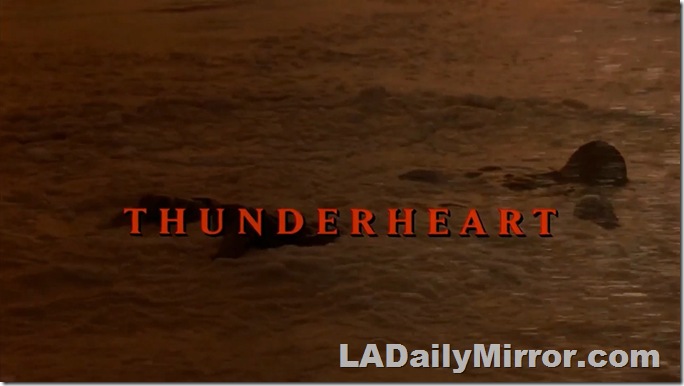 Main title: Red letters over shot of a body floating in a lake. 