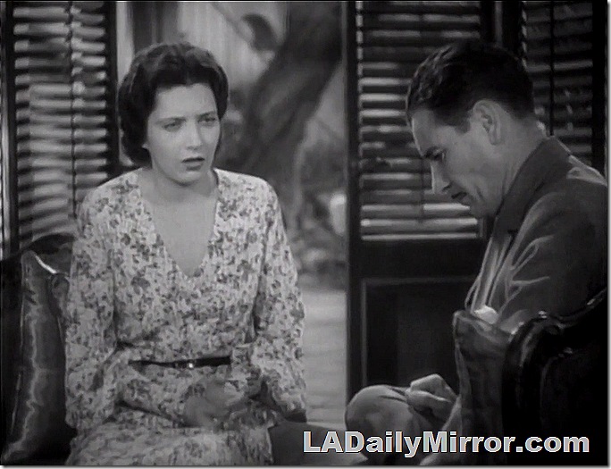 Woman talking to man who is rather anguished. 